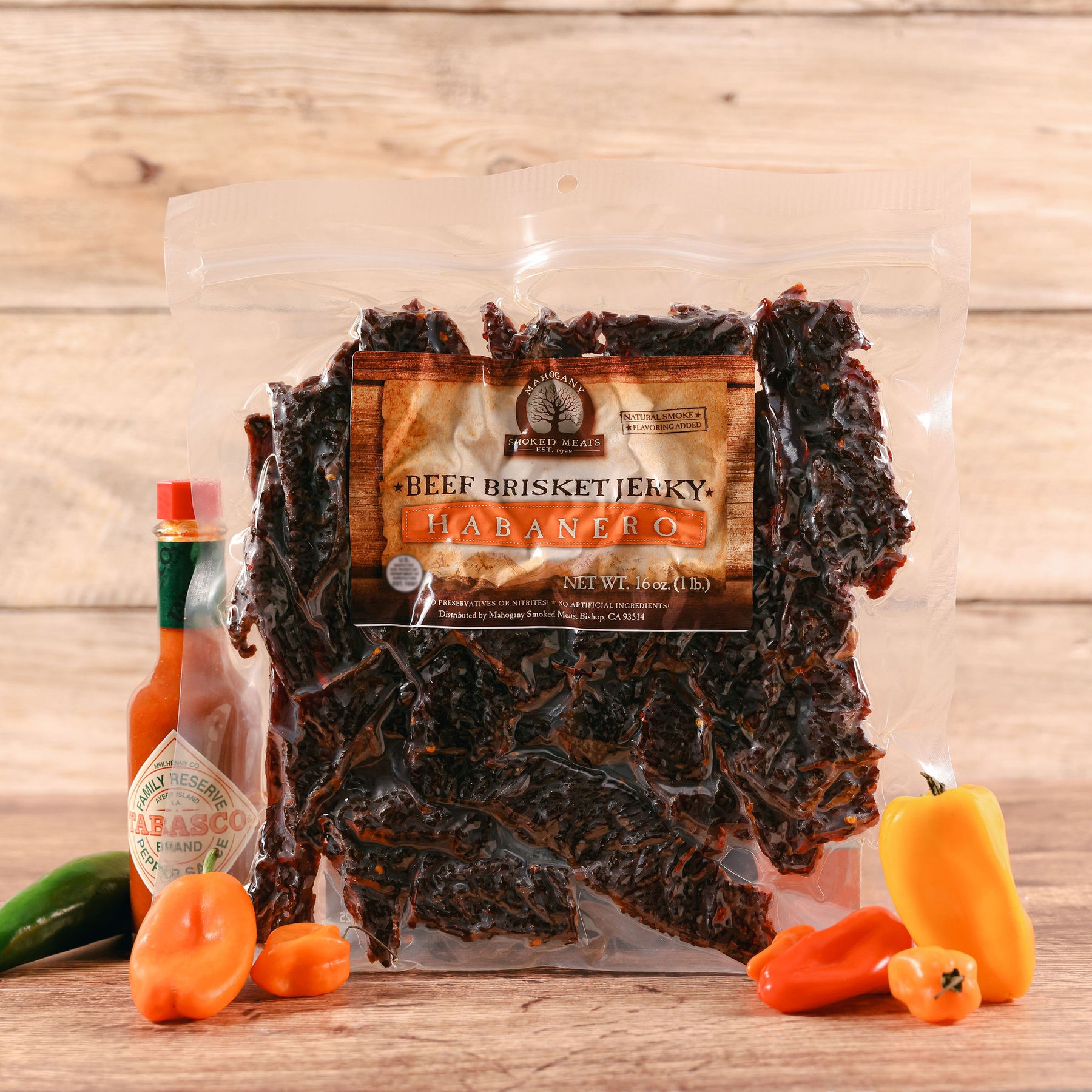 Package of Beef Brisket Jerky labeled "Habanero" with peppers and a Tabasco sauce bottle