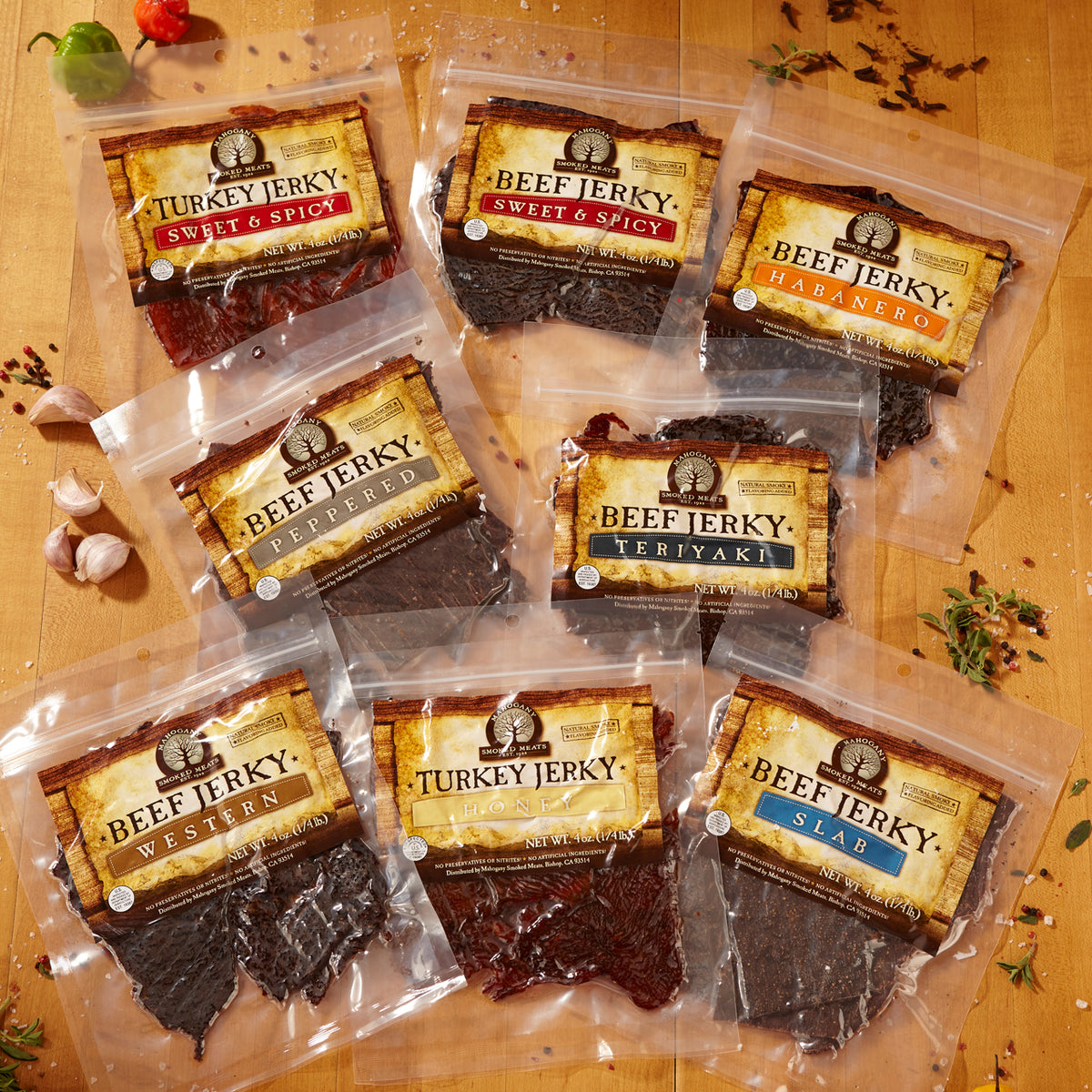 Assortment of beef and turkey jerky packs in sealed clear plastic, labeled with different flavors.