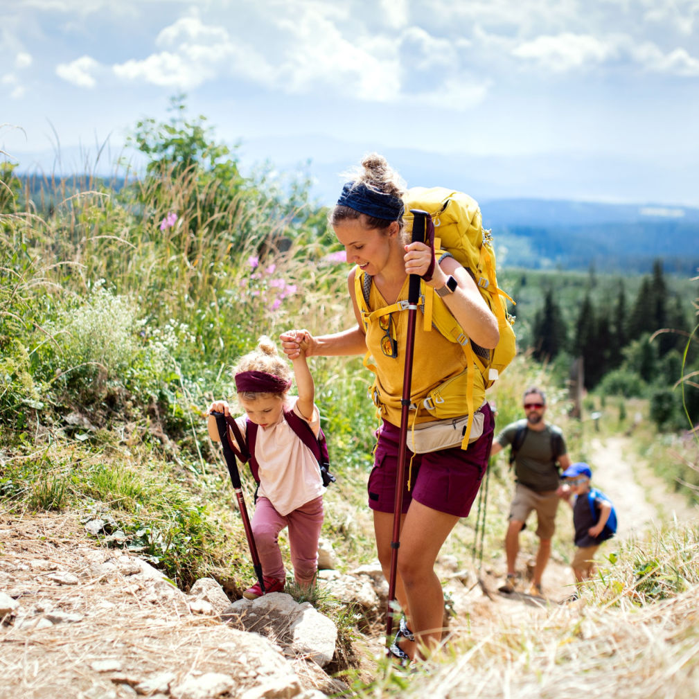 A family hiking on a mountain trail.