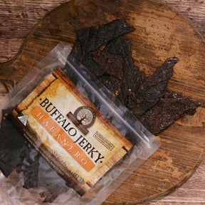 Packaged Buffalo Habanero jerky on an aged wooden surface